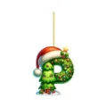 Close-up detail of acrylic letter P Christmas tree ornament with cute cartoon face decor. - Letter P