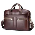 Detailed view of the premium brown leather briefcase front pocket and metallic zipper hardware. - Brown