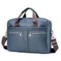 Detailed view of blue leather men's business briefcase with comfortable shoulder strap. - Sapphire Blue