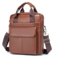 Close-up detail of the premium brown leather men business bag showing fine texture and sturdy hardware. - Brown