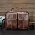 Brown genuine leather men messenger bag featuring double front pockets and top handle for business. - Brown