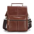 Close-up of brown genuine leather men messenger bag featuring fine stitching and metal hardware. - Brown