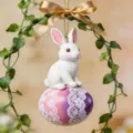 Easter bunny ornament with decorative egg and gold bow, perfect for holiday home and car decor. - Style 4