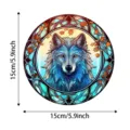 Detailed view of the circular stained glass wolf suncatcher pendant with autumn leaves design. - 16