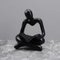 Modern black resin thinker reading sculpture ornament for study room desktop decor. - Right Hand Black