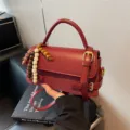 Stylish red small square handbag for women with top handle and wooden bead pendant for daily use. - Red