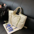 Stylish white quilted tote bag for women with gold chain strap, perfect for daily commute. - Off White