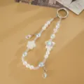 Elegant beaded phone charm with pearls iridescent star flower and teardrop pendant. - Cherry Blossom + Double Teardrop (White) / White