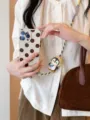 Cadena de teléfono cruzada de pingüino tejido lindo, accesorio portátil elegante. - Estilo Pingüino