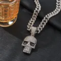 Detailed shot of hip-hop rhinestone skull pendant necklace with Cuban chain texture close up - Pendant With Cuban Chain / Silver