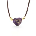 Close-up detail of the purple amethyst heart pendant with gold accent and brown cord necklace. - No. 05