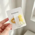 Cute yellow beaded hair tie with clear glitter spheres on card, stylish hair accessory for girls. - Cracked Bead Style / Yellow