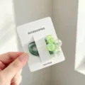 Cute green hair tie rubber band set with lovely decorative beads on a white display card. - Cracked Bead Style / Green