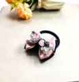 Superbe chouchou avec nœud papillon en strass, ruban rose et noir pour coiffure élégante. - Cravate à cheveux
