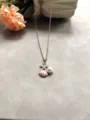 Collier en acier au titane style océan avec pendentif étoile de mer, coquillage et perle. - Rose