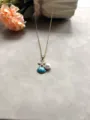 Collier en acier inoxydable doré avec pendentif étoile de mer en cristal, coquillage et perle. - Bleu lac