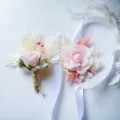 Wedding boutonnière and corsage set featuring pink flowers, feathers, and ribbons for events. - Style 32 (Boutonniere + Wrist Flower)