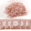 Detailed view of natural pink and white dry flower confetti petals in clear bags for parties. - Style 11 (Bag)