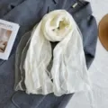 Elegant lightweight wool silk blend white scarf for women, soft shawl detail view. - White