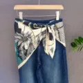 Stylish denim jeans featuring a decorative printed tropical silk scarf tied around the waist. - 43#