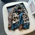Detailed view of fashion leopard print cotton linen shawl scarf with color block design. - Blue and Brown Leopard