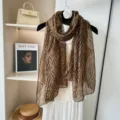 Detailed view of women's lightweight leopard print scarf, soft cotton linen texture sun protection. - 80x180CM / Dark Coffee