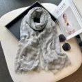 Detailed view of a vintage plaid linen cotton scarf with fringed edges in soft grey green. - 200x75cm / Light Gray