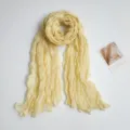Detailed view of the lightweight crinkled yellow scarf featuring soft cotton and linen texture. - 90*180cm / Pleated Solid Off-White