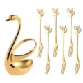 Golden swan holder with six leaf fruit forks detail, elegant stainless steel tableware. - 410 Gold Leaf Fork 6 Pcs + Swan Base