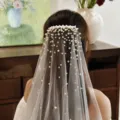 Details of the white wedding veil with scattered pearls and comb, back view elegant bridal piece. - 100cm Length * 160cm Width - Hip Length / V180 Champagne Veil With Comb