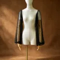 Close-up detail of elegant sheer black mesh detachable sleeves embellished with faux pearls. - One Size / Black