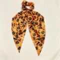 Halloween scrunchie detail view, satin ribbon hair tie with pumpkin and bat print. - Orange Halloween Print (QRJ01)