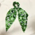 Halloween green skull bat print ribbon scrunchie detail view, soft satin ponytail hair accessory. - Green Halloween Print (QRJ01)