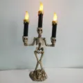 Halloween skeleton candlestick with three LED candles, spooky gothic home party decor. - Gold Triple Candles