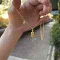 Tibetan style gold-plated enamel prayer wheel necklace with turquoise pendant for women - Rattle Necklace
