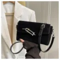 Black suede shoulder bag for women, stylish crossbody handbag with unique metal clasp hardware. - Black