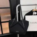 Classic black tote bag for women, large capacity shoulder bag with stylish folded front design. - Black