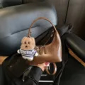 Brown crescent shoulder bag with cute teddy bear pendant, stylish retro commuter handbag for women. - With Pendant / Brown