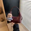 Burgundy crescent shoulder bag for women, retro hobo handbag with cute plush puppy pendant. - With Pendant / Burgundy
