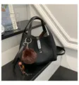 Black litchi grain bucket bag with furry pom pom charm and metal lock closure stylish. - With Pendant / Black