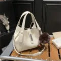 White litchi grain leather bucket bag with top handles and stylish metal lock closure SKU. - With Pendant / White
