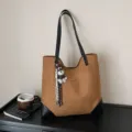 Brown suede tote bag with black shoulder straps and cute puppy charm for daily commuting - With Pendant / Brown