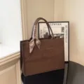Brown suede tote bag with stylish scarf handle and front letters, large capacity daily shoulder handbag. - S / Coffee
