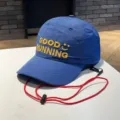 Closeup of blue kids baseball cap with yellow embroidery Good Running and red wind strap. - 4-10 Years / Dark Blue