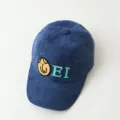 Navy blue corduroy baseball cap detail shot featuring cute embroidered smiley face and EI letters. - 3-10 Years / Smile Style / Blue
