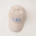 Corduroy kids baseball cap detail view, featuring blue embroidered AEI letters on beige fabric. - 3-10 Years / Big A Style / Beige