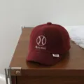Detailed shot of a red corduroy baby baseball cap with embroidery, showing texture and design. - 46-48cm / Burgundy