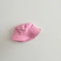 Detailed view of the pink washed cotton bucket hat, soft fabric for kids sun protection. - 49-52cm / Pink