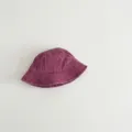 Detail view showing the soft washed cotton kids bucket hat in solid purple color design. - 49-52cm / Fuschia
