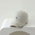 Kids beige baseball cap with playful letter embroidery and curved brim style. - Off White